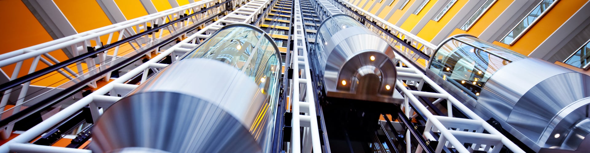 glass elevators on building interior